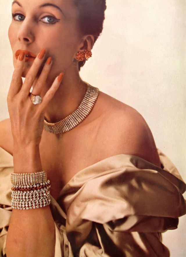 #11 Barbara Goalen in Jacqmar stole and Adrian Mann jewelry, Harper’s Bazaar UK, December 1951.