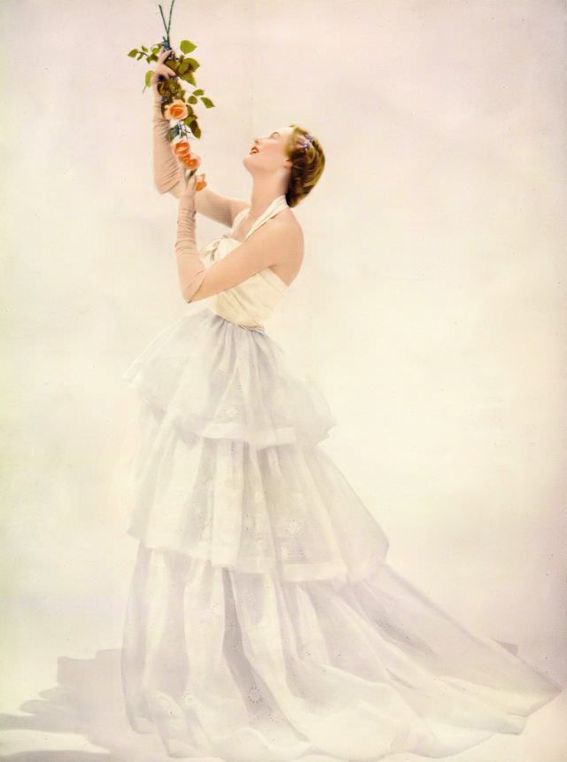#16 Model in Victor Stiebel’s embroidered organdie dance dress, Harper’s Bazaar UK, April 1951.
