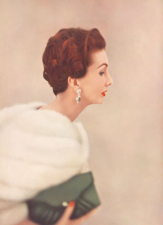 #25 Barbara Goalen with Raymond hair styling, earrings and purse, Harper’s Bazaar UK, April 1952.