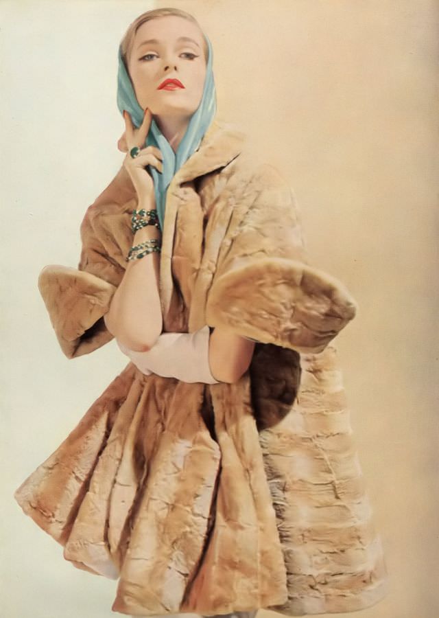 #34 Susan Abraham in Arthur Poliakoff’s mole evening wrap, Harper’s Bazaar UK, September 1952.