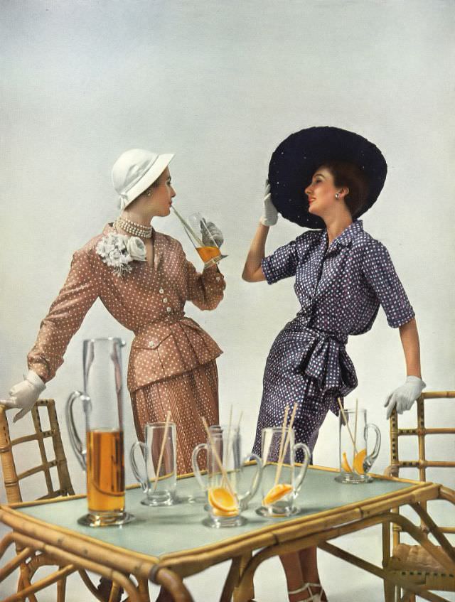 #6 Pat O’Reilly and Barbara Goalen in Molyneux and Hardy Amies dresses, Harper’s Bazaar UK, May 1950.