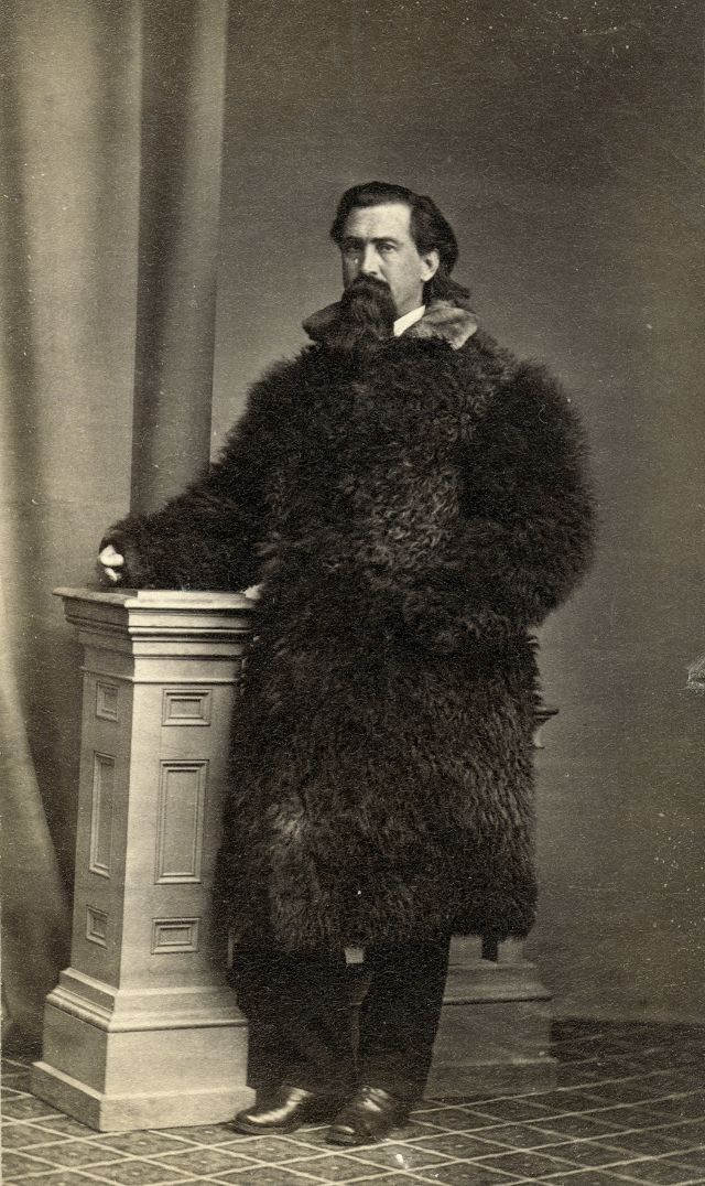 #29 Man is dressed in a long robe made of a buffalo hide and a fur collar
