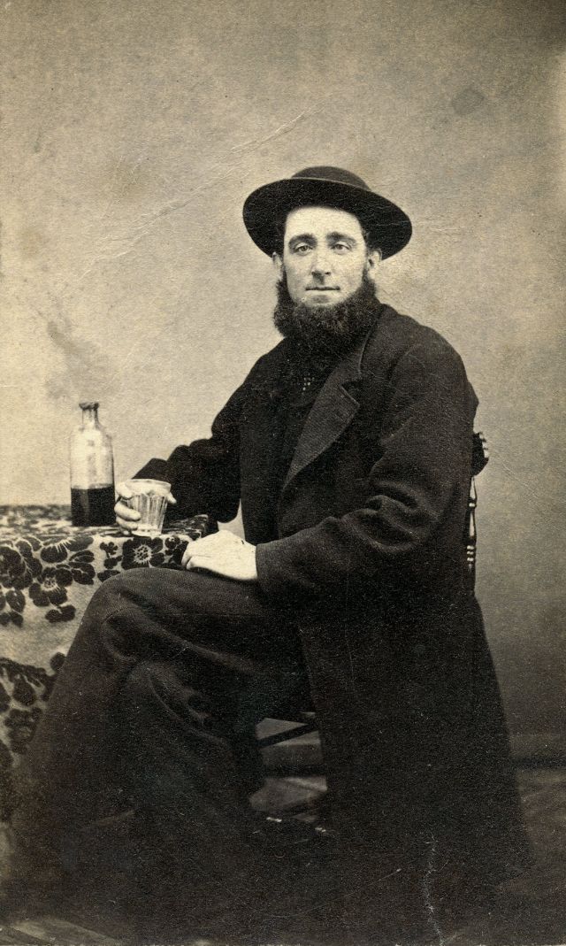#30 Man posing for a glass of whiskey