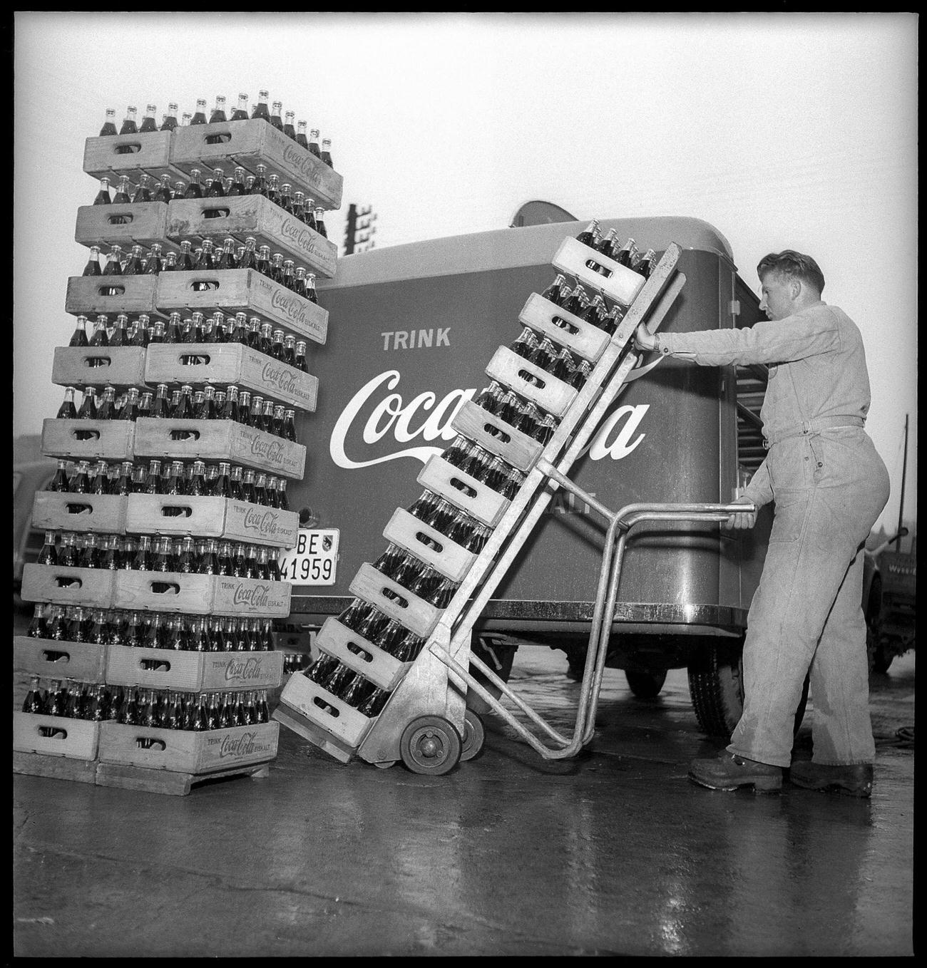 #4 Coca-Cola worker loading a delivery van, 1949.