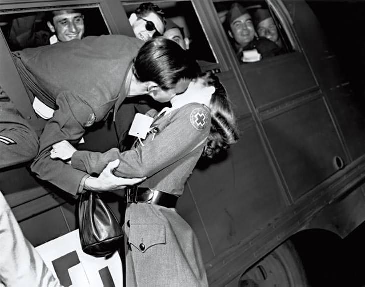 #37 Soldier kissing Red Cross nurse, 1945.