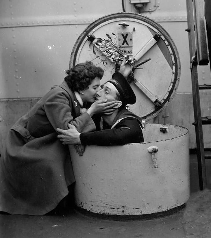 #38 D. Brown kissing fiance Terry, HMS Wakeful, Portsmouth, 1955.