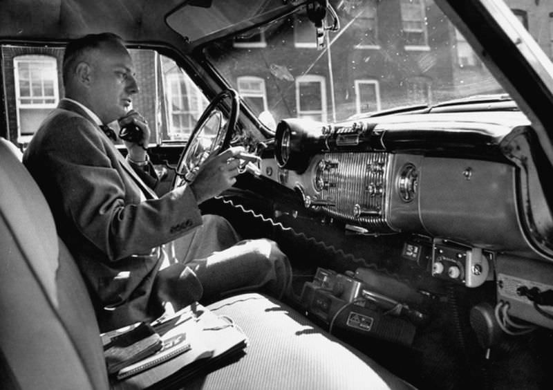 Man with cigar and car phone, circa 1953.