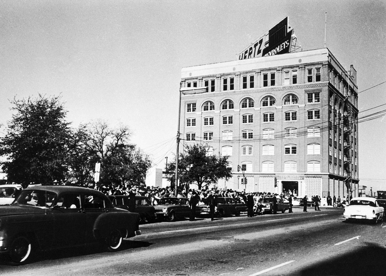 #13 A crowd awaits President Kennedy’s motorcade at Dealey Park in Dallas, Texas, just prior to his assassination, 1963.