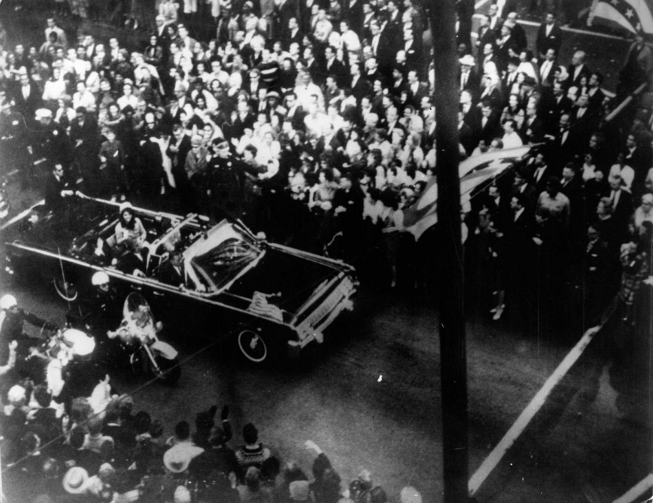 #2 John F. Kennedy and First Lady Jacqueline Kennedy in the presidential motorcade in Dallas, Texas, shortly before his assassination, 1963.