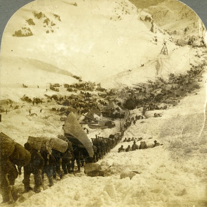 #96 Miners and packers climbing the Golden Stair Trail at Chilkoot Pass, Alaska.