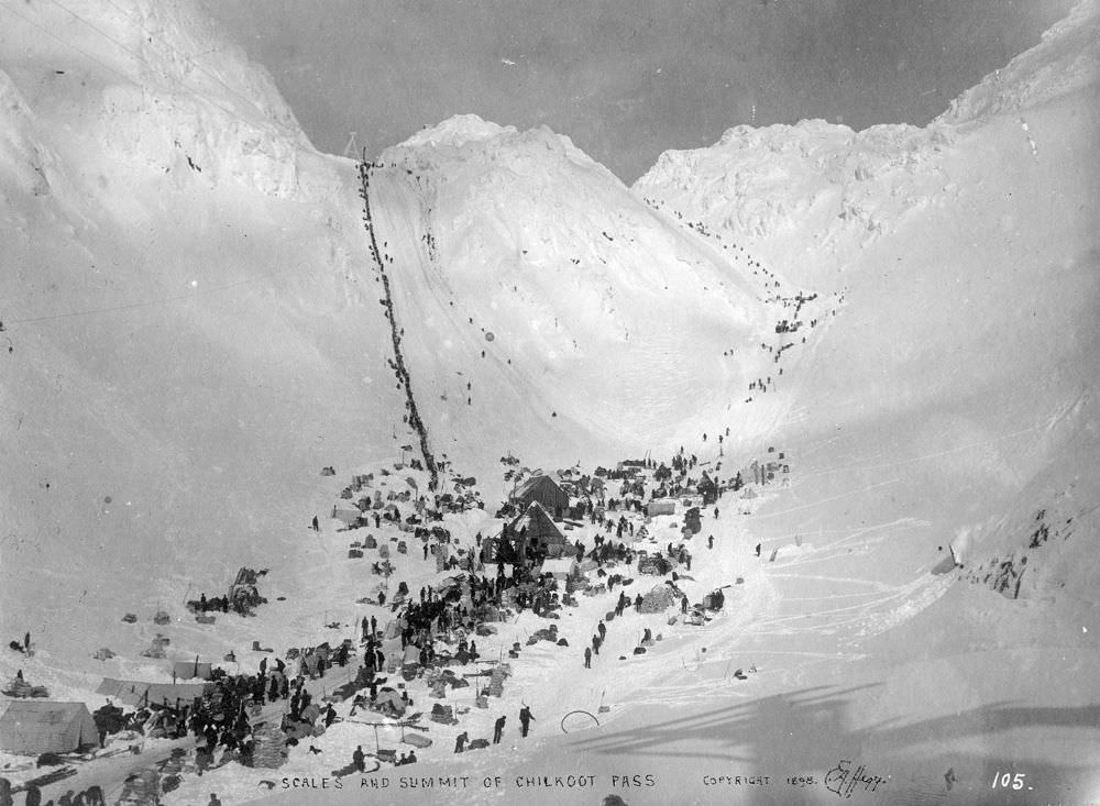#111 Prospectors with supplies at Chilkoot Pass, featuring The Scales and Golden Steps, circa March 1898.
