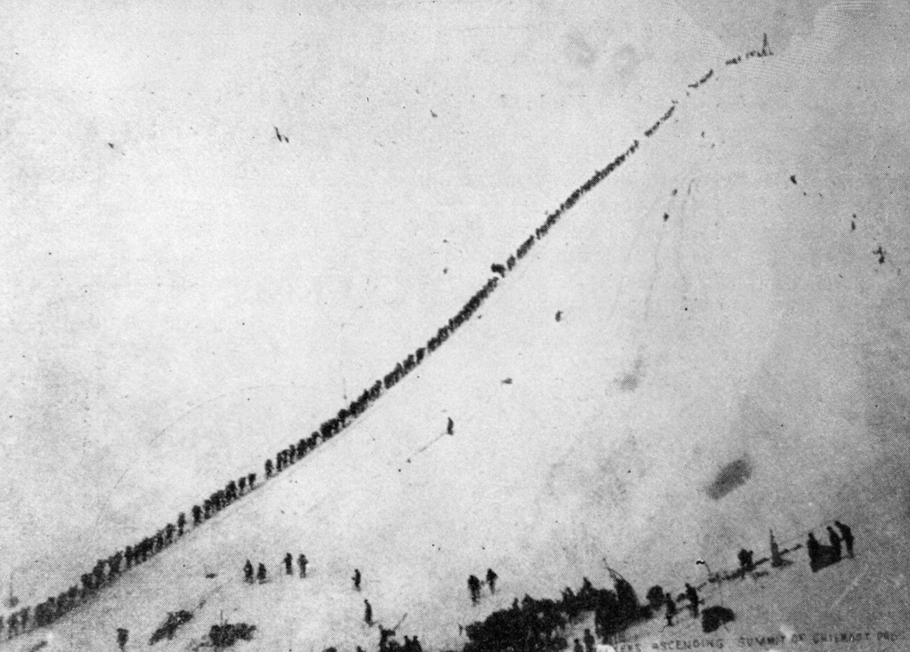 #13 Prospectors ascending Chilcoot Pass by rope after gold discovery in the Klondike.