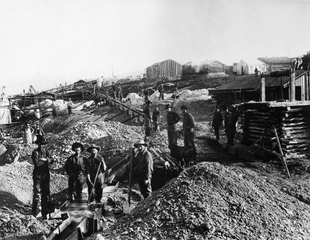#14 Miners using sluices to mine gold on “Gold Hill” near Dawson in the Yukon Territories, Canada.