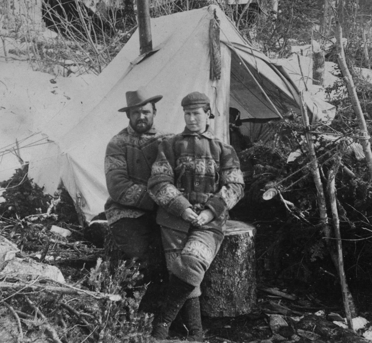#1 A man and woman in front of a tent in Alaska during the Klondike Gold Rush, 1898.