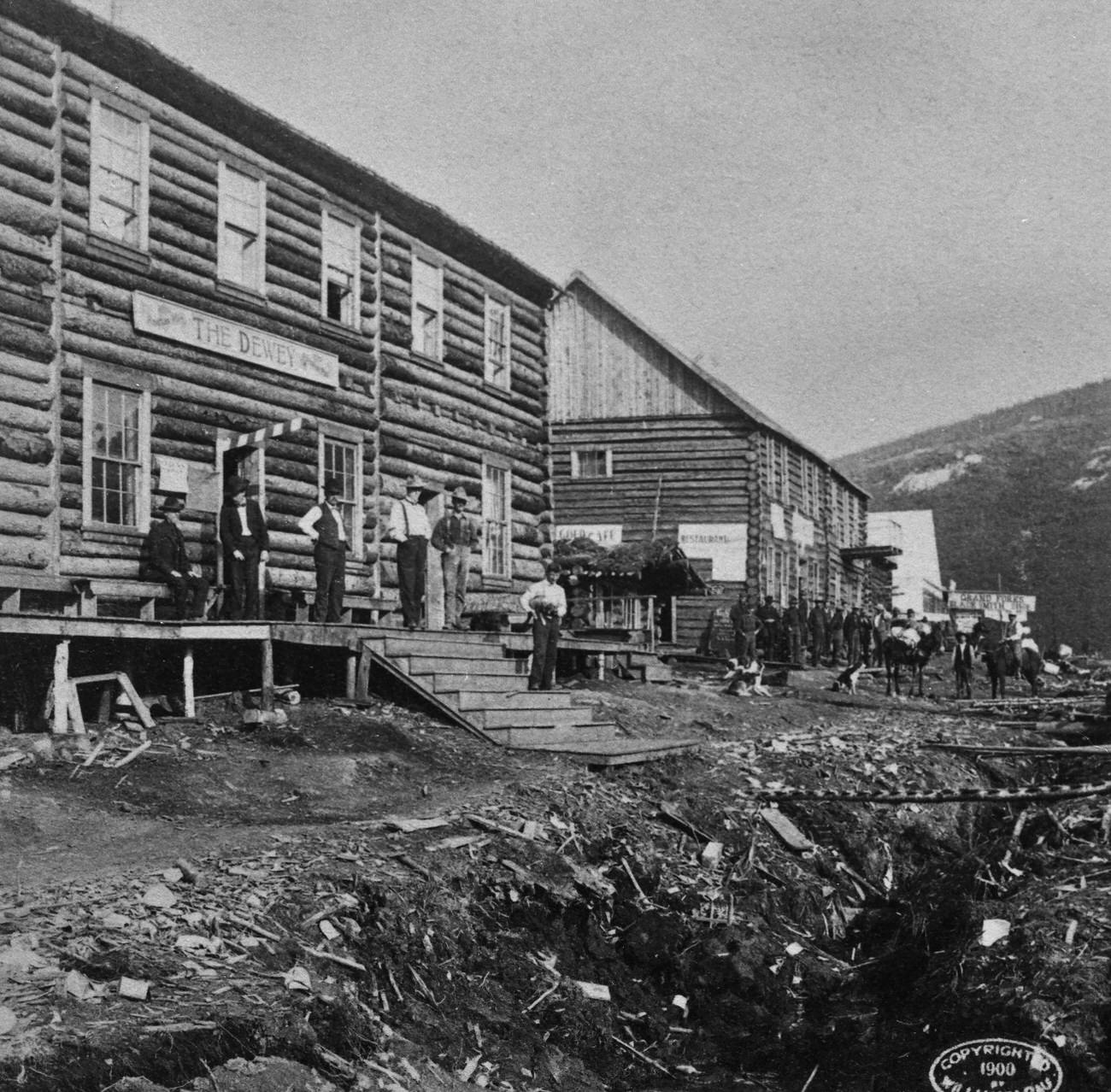 #30 People outside hotels at the Grand Forks of the Eldorado and Bonanza Rivers during the Alaska Gold Rush, 1897.