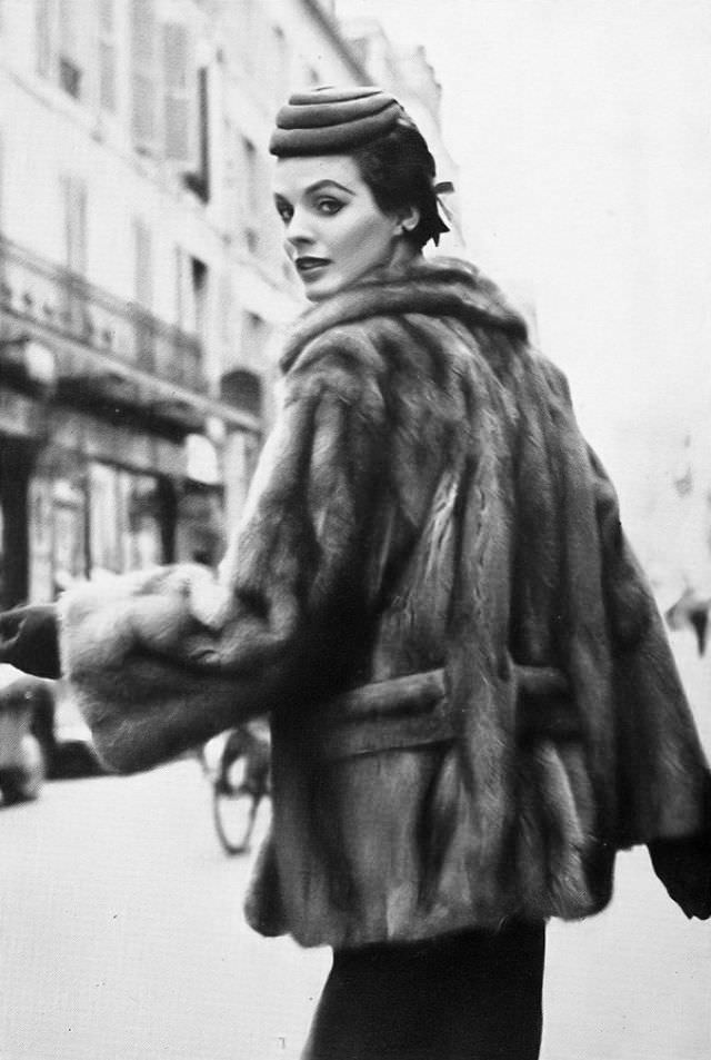 #21 Linda Harper in a wild mink jacket with a low slotted belt by Christian Dior, Paris, 1953.