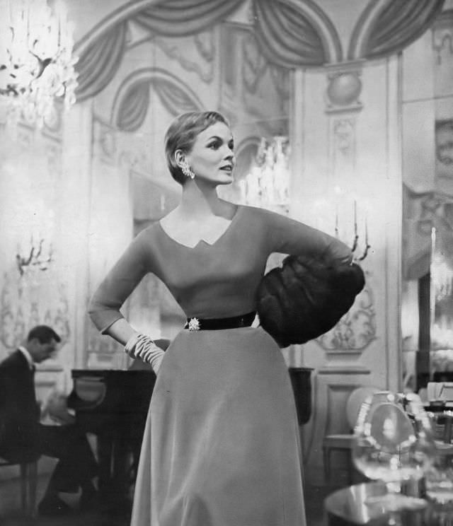 #8 Linda Harper in an amber velvet dress with a bronze belt by Eisenberg, 1954.