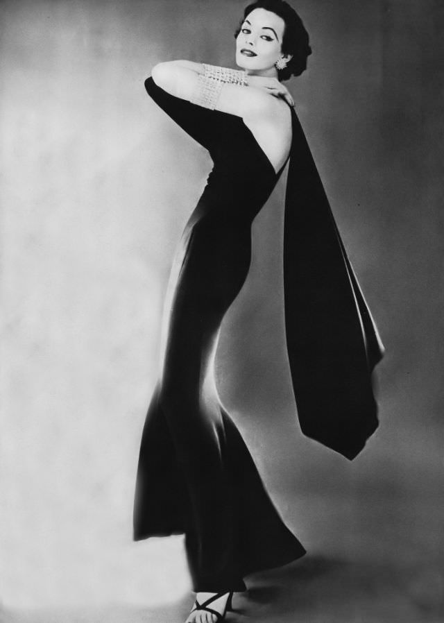 #2 Linda Harper in a slinky black silk crêpe evening dress by Traina-Norell, 1952.