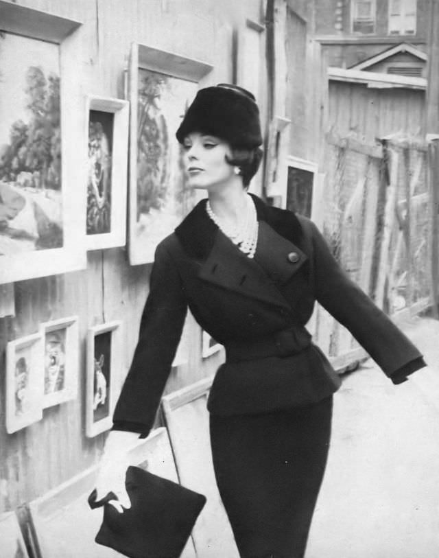 #29 Linda Harper in a black wool suit with Jet velvet details by Dan Millstein, 1959.