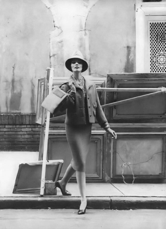 Linda Harper in a Chanel cut tweed suit with a printed silk blouse by Dan Millstein, 1959.