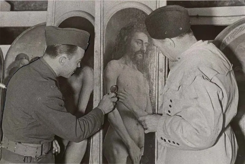 #22 Lt. Daniel J. Kern, Karl Sieber examining Ghent Altarpiece panel, 1945.