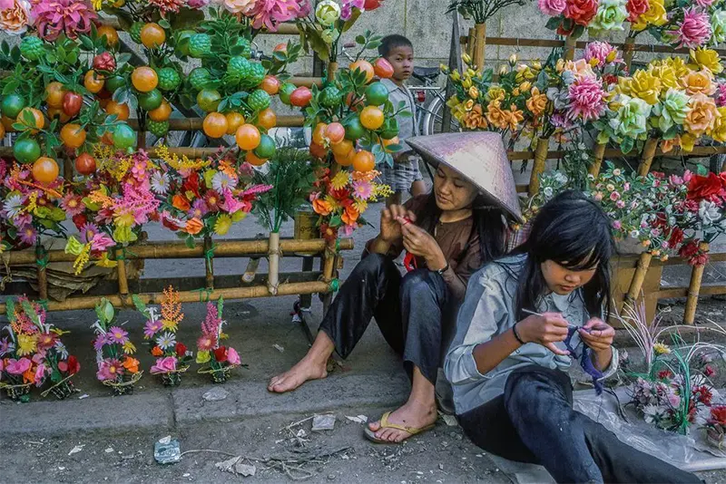 #13 Flower girls at My Tho marketplace, Dinh Tuong Province, 1969.