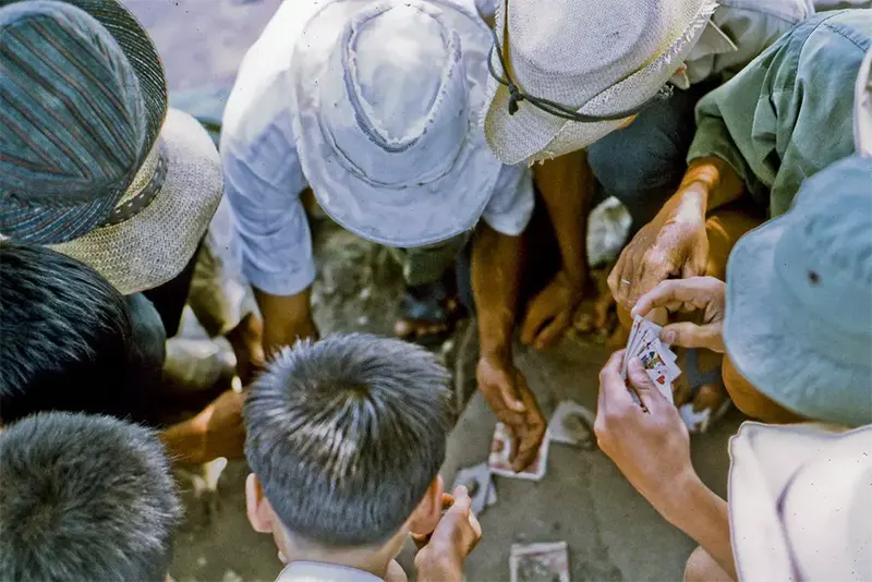 #15 Local men playing cards, northeast My Tho, 1969.