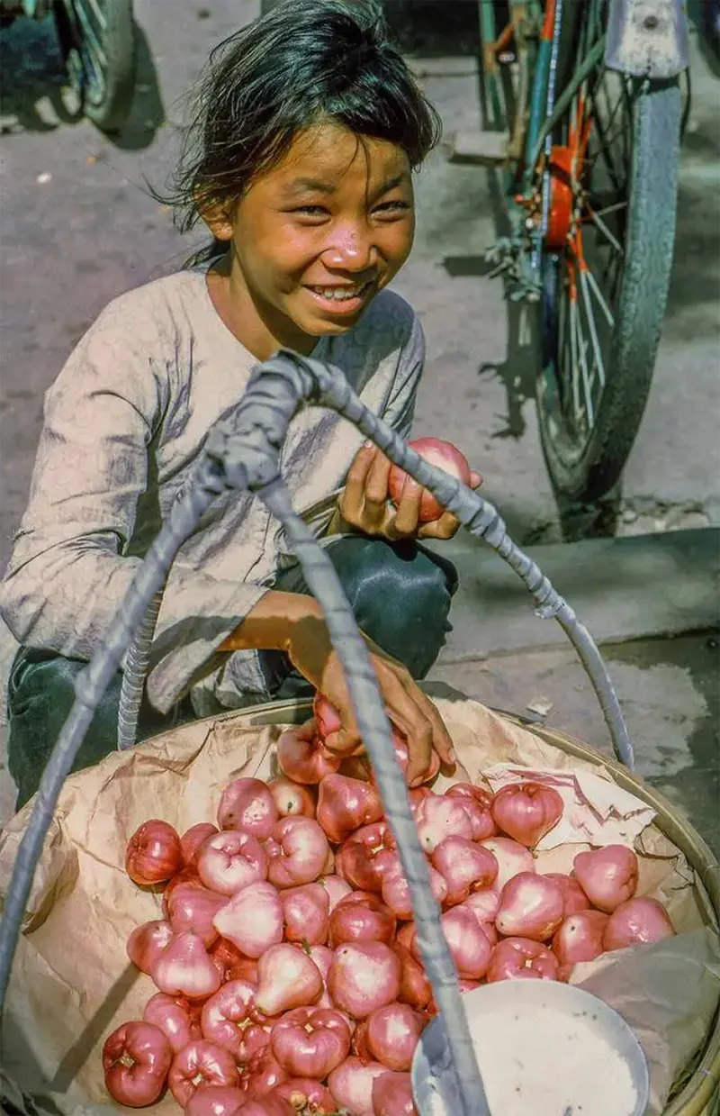 #17 Girl selling produce, My Tho market, 1969.
