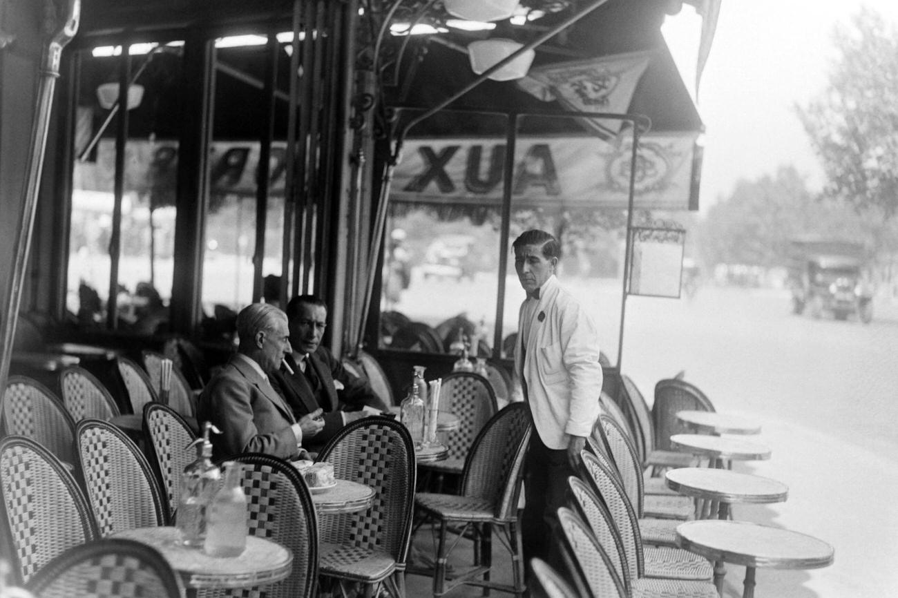 #7 Composer Maurice Ravel at a Cafe Terrace in Paris, 1930