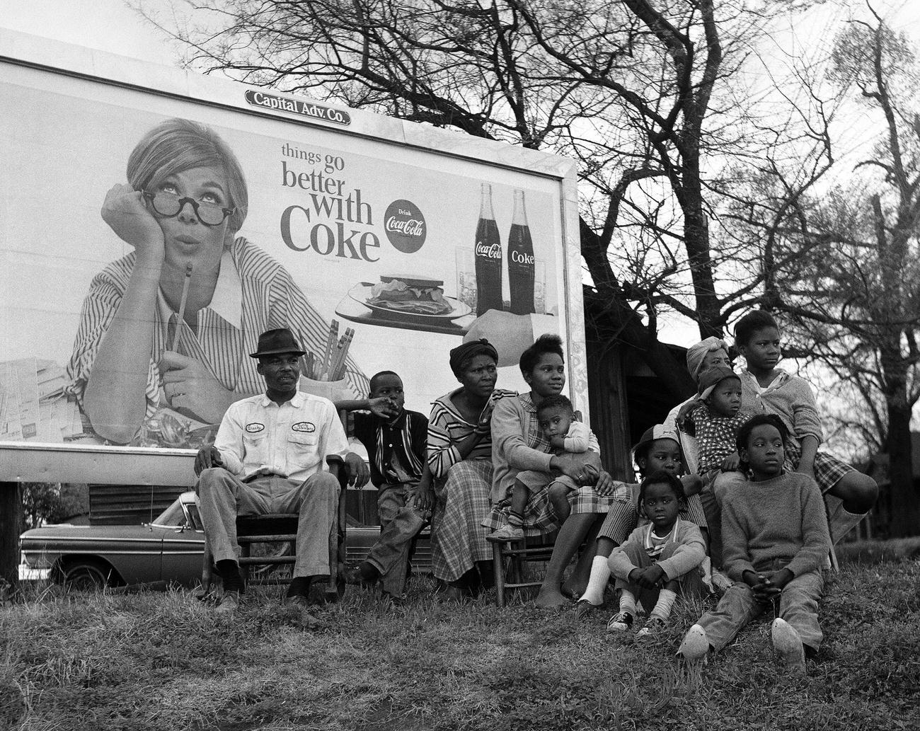 #101 African American family watching the Selma To Montgomery Civil Rights March, March 25, 1965.