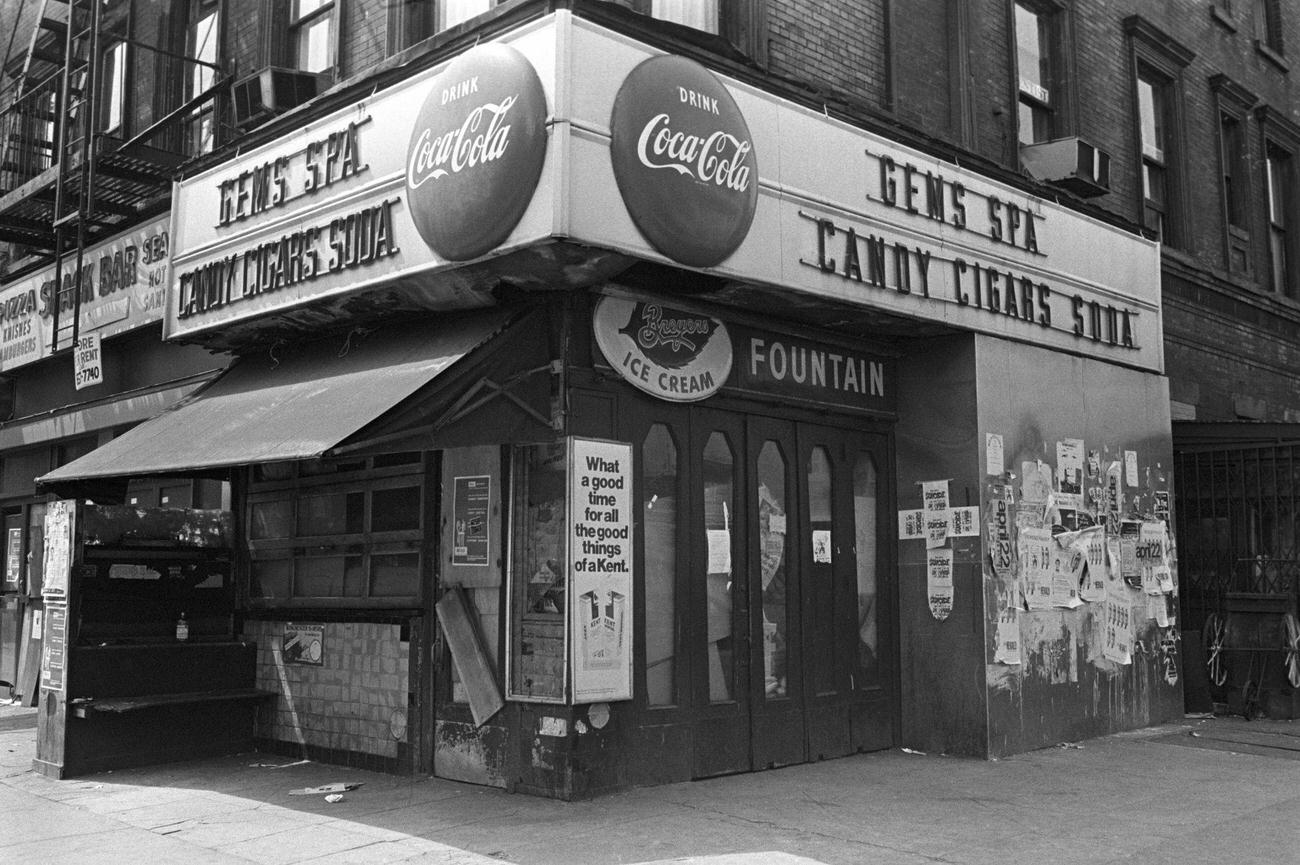 #21 Gems Spa, a candy store in East Village, New York, advertising Coca-Cola.