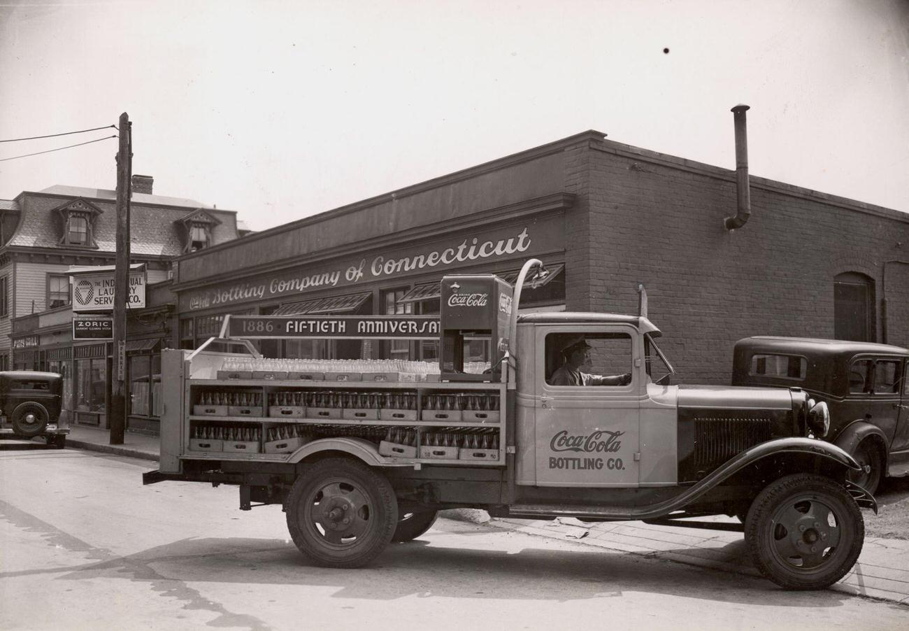 #32 Truck loaded with bottles leaving the Coca-Cola Bottling Company of Connecticut on the product’s 50th anniversary, 1936.