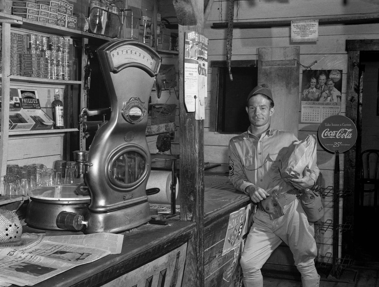 #42 A soldier shopping in a general store in Caroline County, Virginia, June 1941.