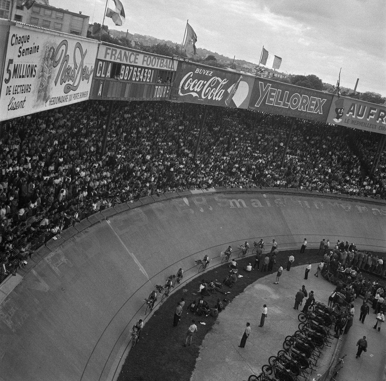 #72 39th Tour De France arrival in Paris, 1952, with painted advertisements.