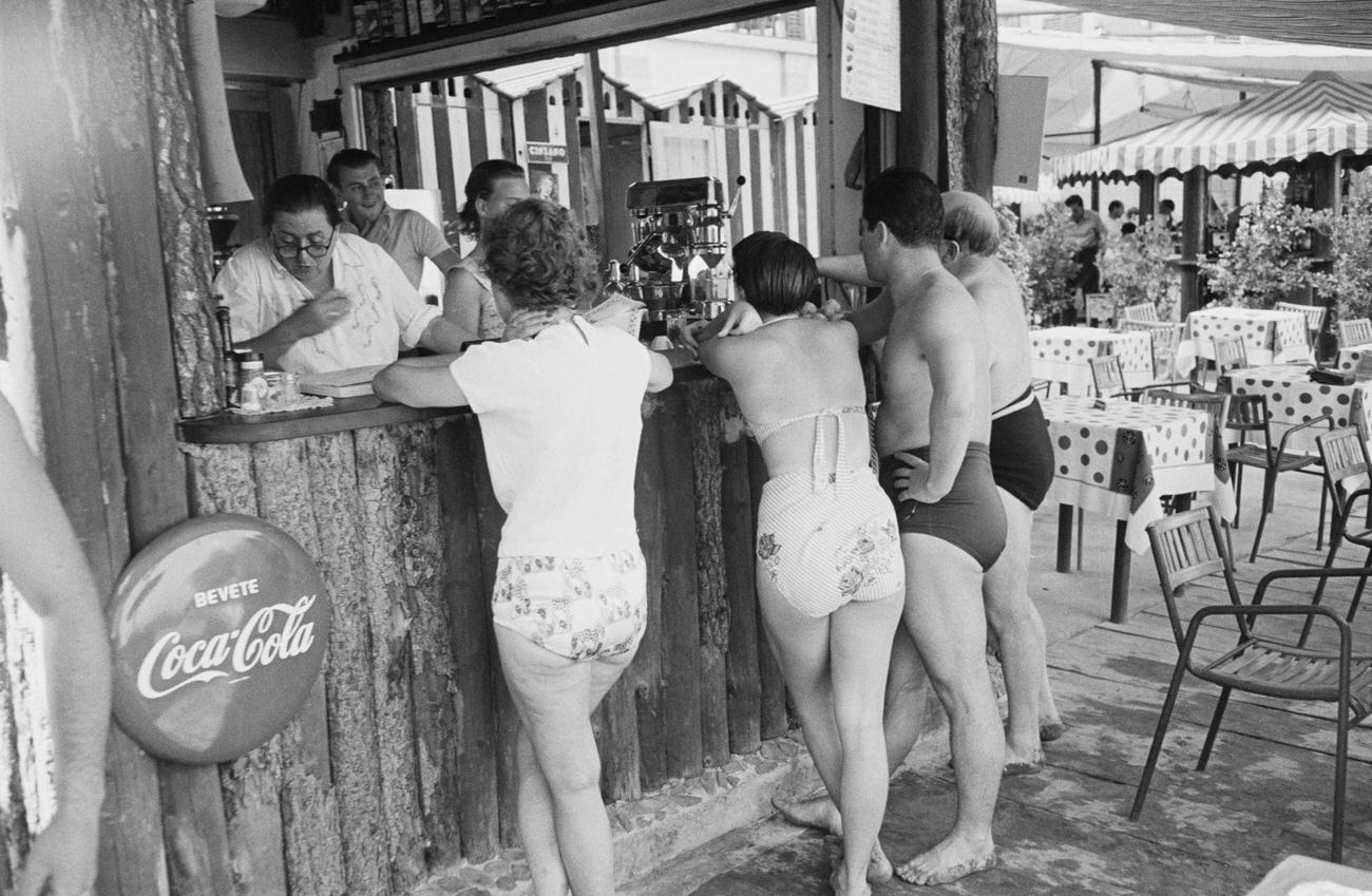 #73 Customers at a bar on Paraggi Beach near Portofino, Italy, August 1952.