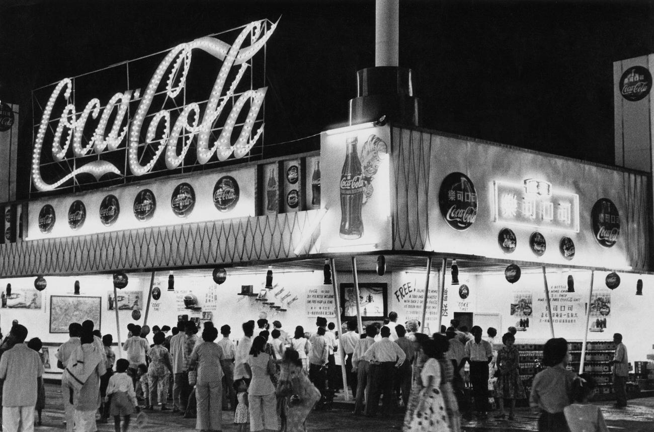 #80 A Coca-Cola stand in Singapore, circa 1955.