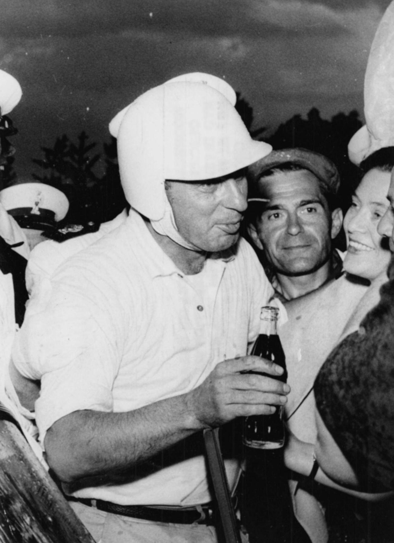 #91 Racing driver Alfonso Thiele with Coca-Cola after winning Monza Grand Prix, June 28, 1959.
