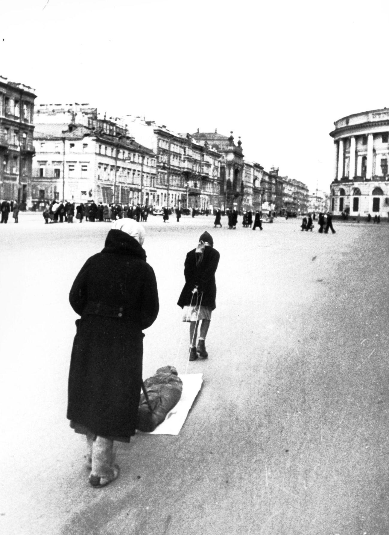 #23 Victims of Nazi Bombing with Dead Child, Leningrad Blockade, 1942