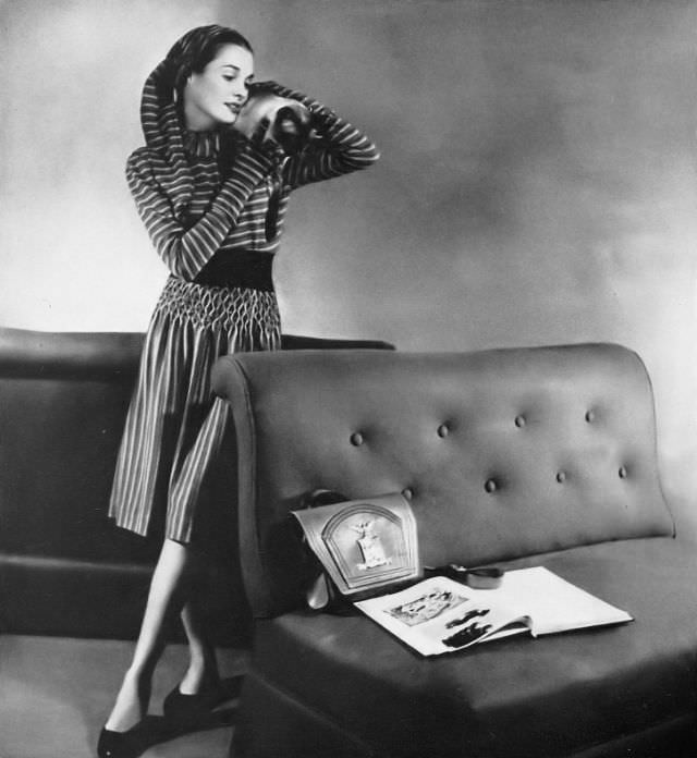 #12 A model in a two-piece dress with a striped blue, pink, and white jersey skirt by Tina Leser, Harper’s Bazaar, 1946.