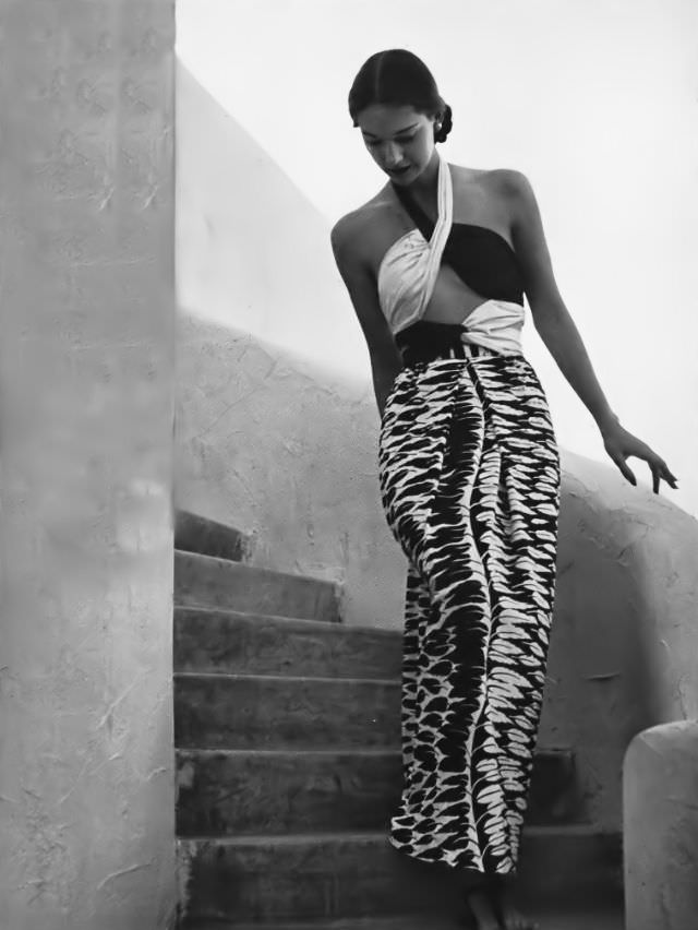 #4 Marilyn Ambrose in a black and white rayon jersey cabana dress with sequined leaves by Tina Leser, Arizona, Vogue, 1945.
