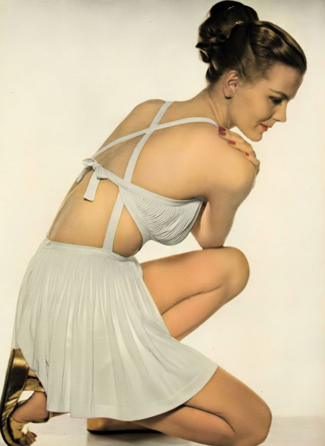#8 Selene Mahri in a Greek-goddess rayon jersey bathing suit by Tina Leser, Vogue, 1945.