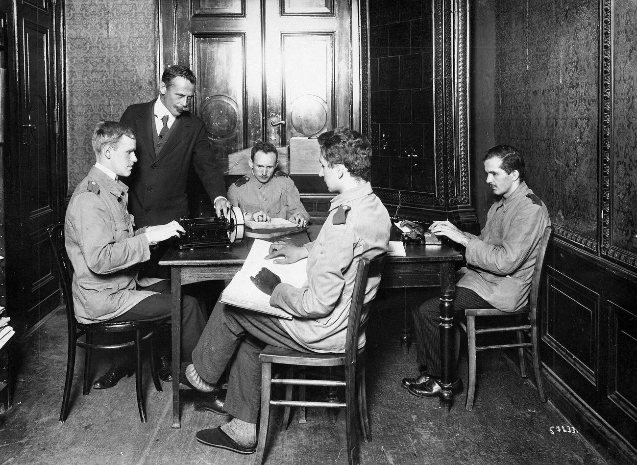 #11 Blind teacher with blind pupils learning braille and typing, 1917.