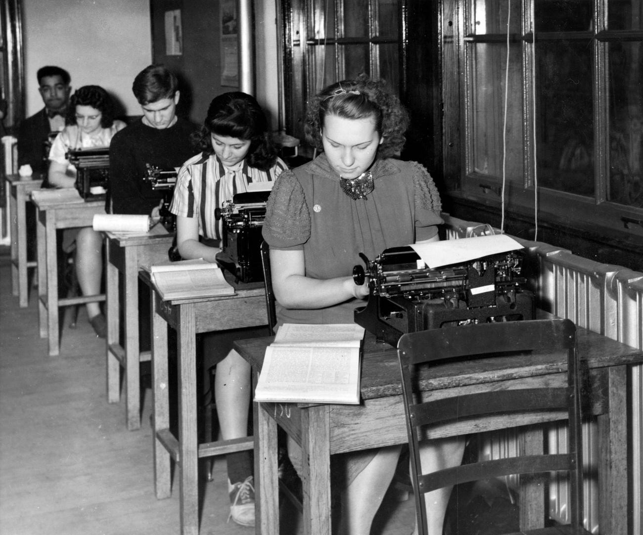 #20 Students practicing touch typing at Hutchinson Central High School, Buffalo, New York, circa 1930.