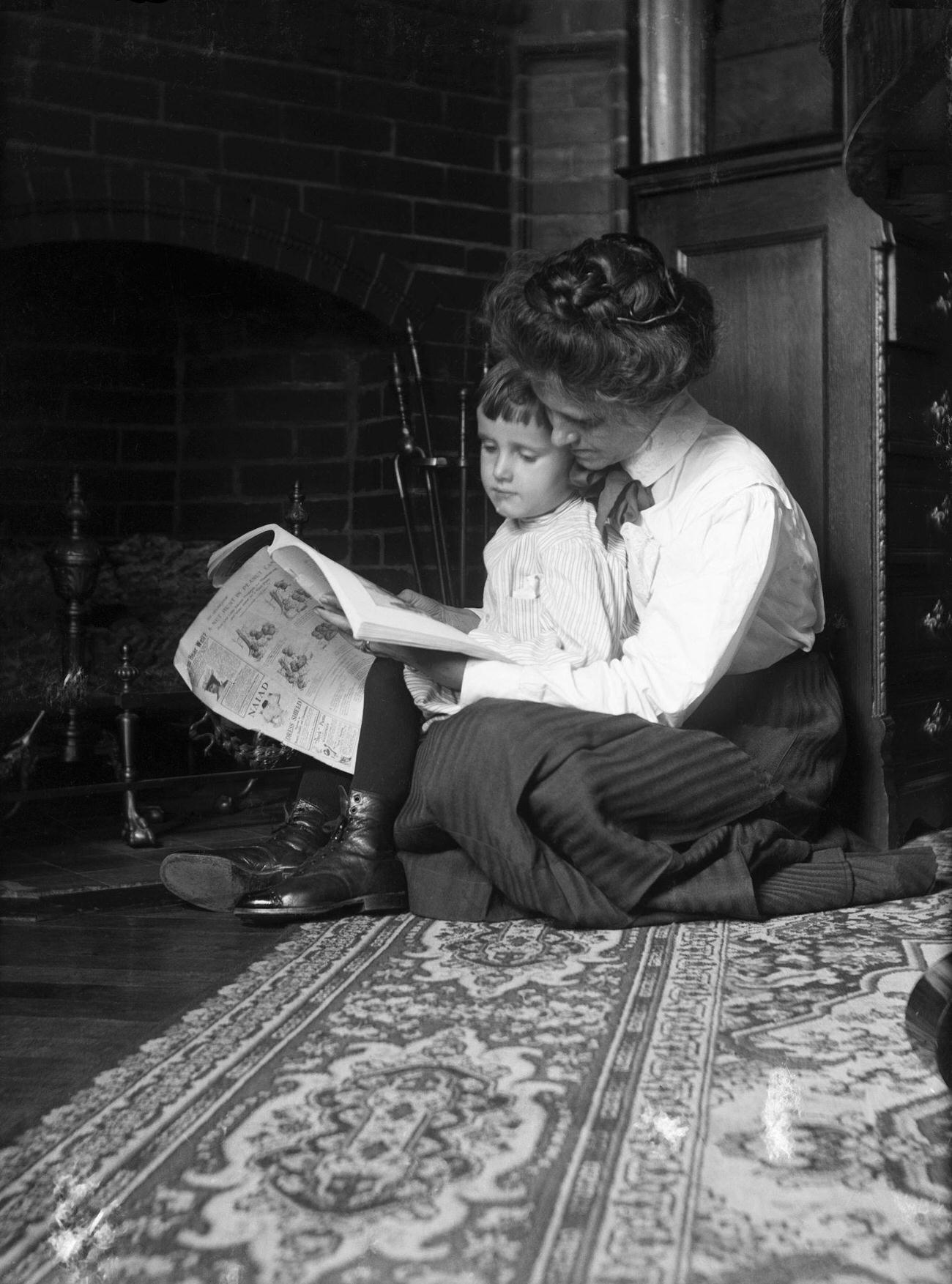 #26 Victorian mother and child reading by a fireplace, 1890.