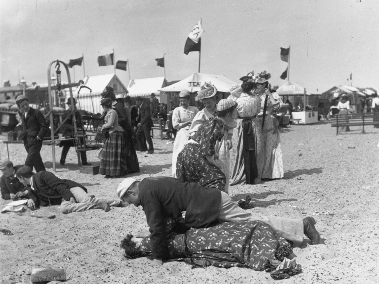 #37 A Victorian couple on a crowded Yarmouth beach, 1895.