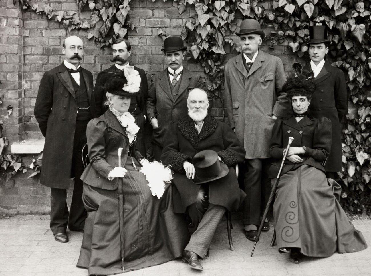 #63 Victorian group posing in a garden, circa 1900.