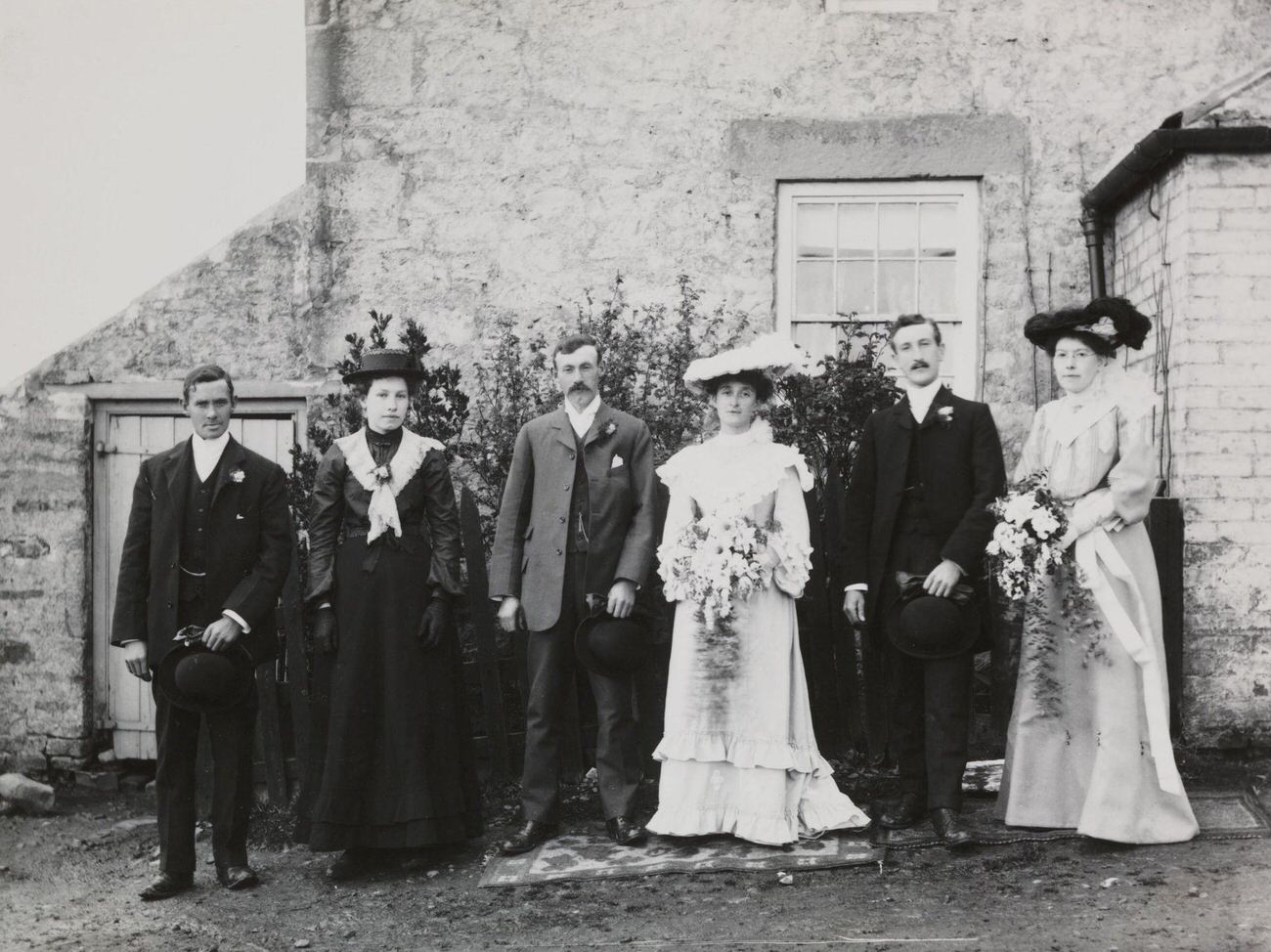 #64 Wedding party snapshot, circa 1900.