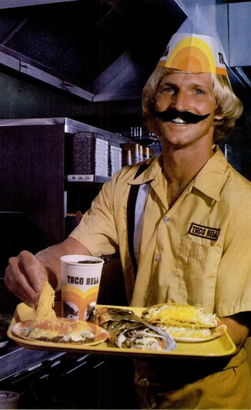 #13 Taco Bell employees with fake mustaches, 1960s.