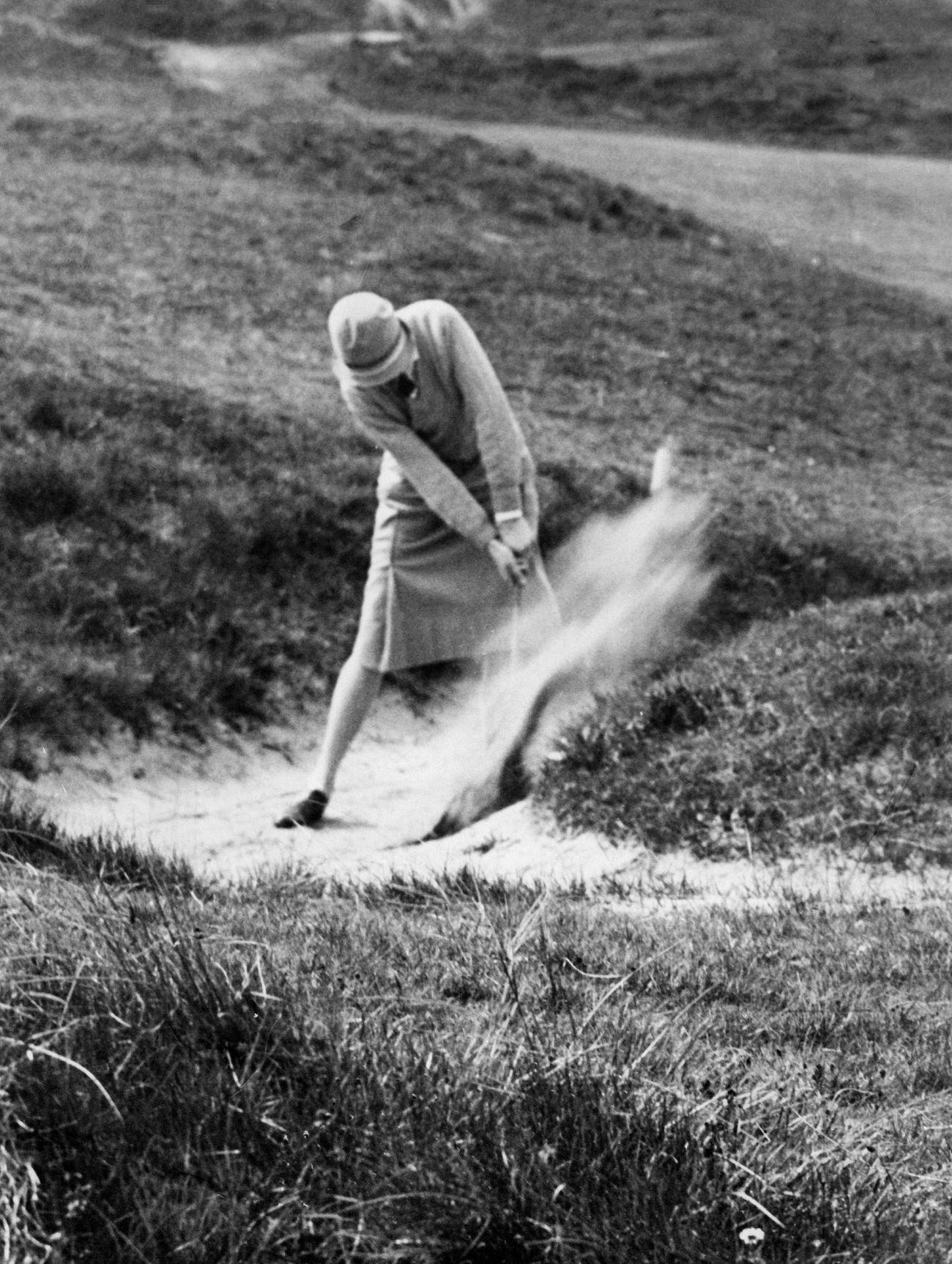 #63 P. Garon playing bunker shots, National golf women festival, Newcastle, 1927.