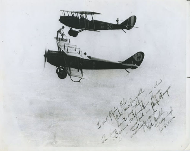 On this autographed photo of Gladys Gertrude Ingle (1899-1981) preparing to transfer from Bon MacDougall’s plane to Art Goebel’s plane.